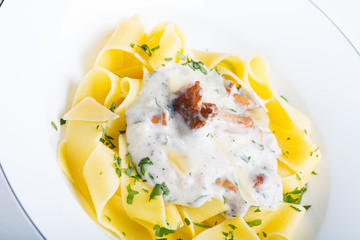 Pasta with cream sauce with chanterelle