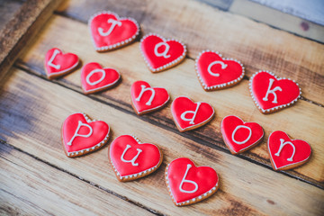 Red heart cookies on wooden background Valentine's day