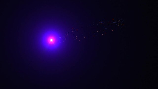 An animated lighted pink orb releases floating, colorful small particles randomly throughout a dark purple background..