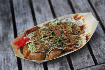 Takoyaki on wood background