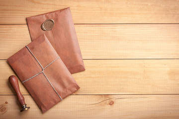 Retro style envelopes on wooden desktop