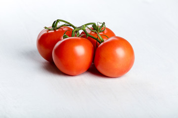 Four red fresh juicy tomatoes