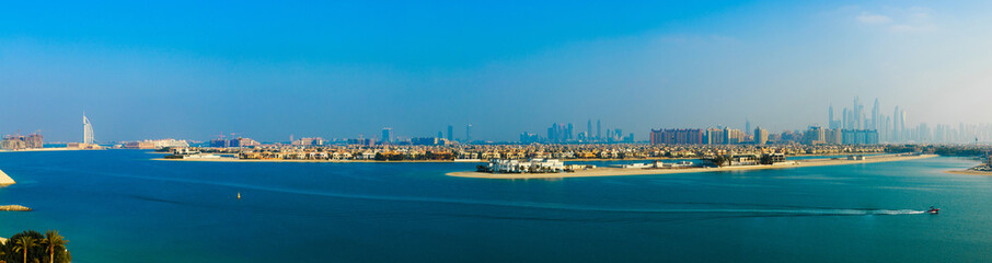 Beautiful palm island in Dubai. Panorama view with Dubai city sk