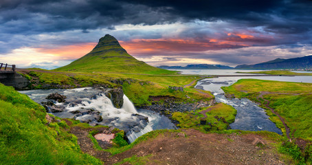 Summer sunset on famous Kirkjufellsfoss Waterfall