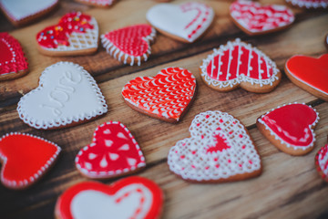 Red heart cookies on wooden background Valentine's day