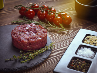 Beef tartar on a stone plate.