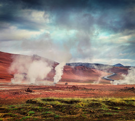Fototapeta na wymiar Steaming fumarole in geothermal valley Hverarond,