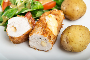 Kiev cutlet with jacket potatoes and salad