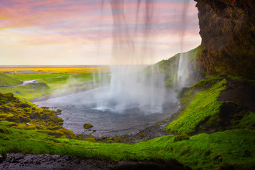 Fototapeta na wymiar Colorful evening view from the middle of famous Seljalandfoss Wa