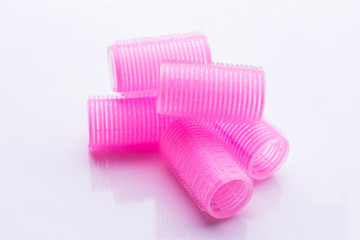 Hair curlers on white background
