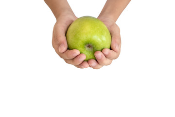 Closeup a fresh green apple in children hands isolated on white background.