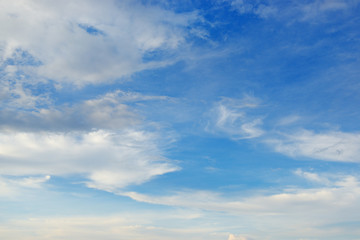 Light cirrus clouds in the bright sky.