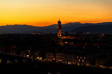 Fototapeta na wymiar Florence at sunset with floodlight at Palazzo Vecchio