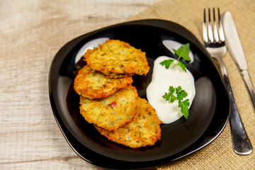 Potato pancakes with sour cream and parsley