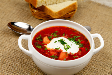 Traditional Ukrainian borsch with sour cream