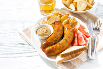 fried pork sausages with potatoes and mustard 