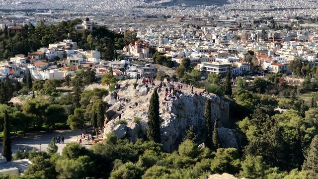 ATHENS, GREECE. JANUARY, 2017. Tourists climb the Areopagus hill, ancient Athenian court near the Acropolis
