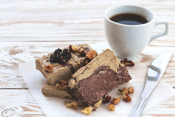 Marble sesame halva with cocoa and cup of coffee