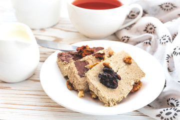 Marble sesame halva with cocoa and cup of tea