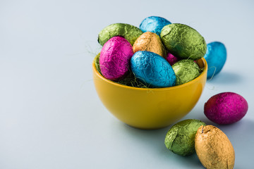 Colourful easter eggs in metallic wrapping
