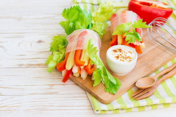 Spring roll with vegetables and white sour cream souce