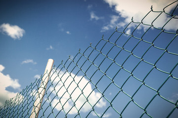 Fence on blue sky background