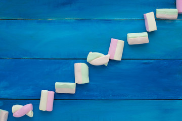 marshmallow candies in a diagonal shape, isolated, view from above