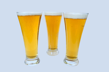 three glasses of beer isolated on the white background
