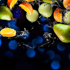 Naklejka na ściany i meble Orange and apples fruits and Splashing water