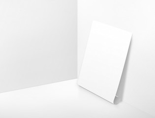 Naklejka premium Blank white rolling poster at corner painted white color studio