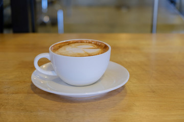Hot coffee on table.