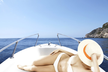 Fototapeta na wymiar woman in bikini on boat 