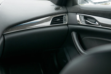 Car interior, dashboard, trims, air vent and door handle.