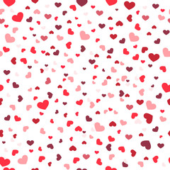 Many falling hearts on white background. Seamless pattern. Vector background.
