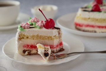 Dwlicious cake dessert with cream, cherries and coffee
