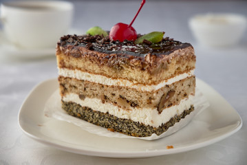 Dwlicious cake dessert with cream, cherries and coffee