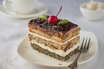 Dwlicious cake dessert with cream, cherries and coffee