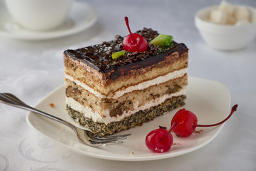 Delicious cake dessert with cream, cherries and coffee