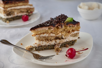 Delicious cake dessert with cream, cherries and coffee