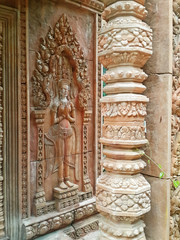 Fototapeta na wymiar Stucco elements of the abandoned hotel in angkor style. Style of the temple ruins of the Khmer The jungle of Koh Phangan, Thailand