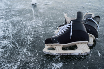 hockey scates on ice pond riwer