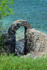 old stone gate to the shore