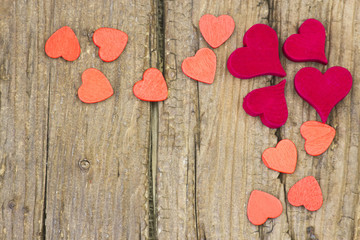 red hearts on wooden background