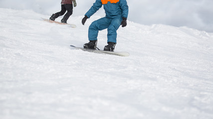 Fototapeta na wymiar Snowboarding on slope