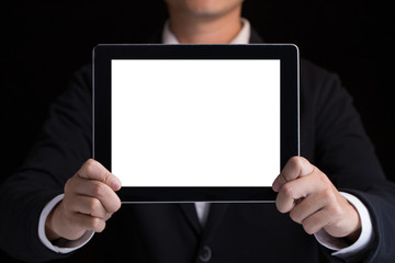 A business man holding blank digital tablet showing copy space