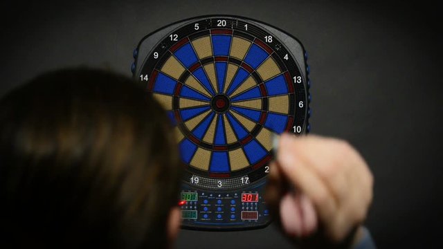 man playing darts