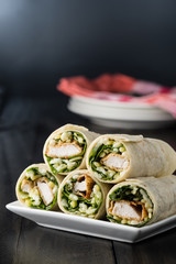 Breaded Chicken burrito Wrap With Fresh Lettuce Cheese on rustic