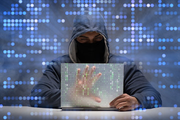 Young hacker in data security concept © Elnur