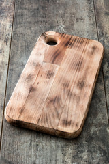 Cutting board on wooden background
