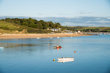 View of the Camel estuary at low tide with the touristic village Rock in Cornwall. View from Padstow on the opposite site of the estuary.